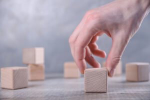 Hand Puts One Blank Wooden Cube With Space Your Word Letter Symbol Table Place Text Free Copy Space